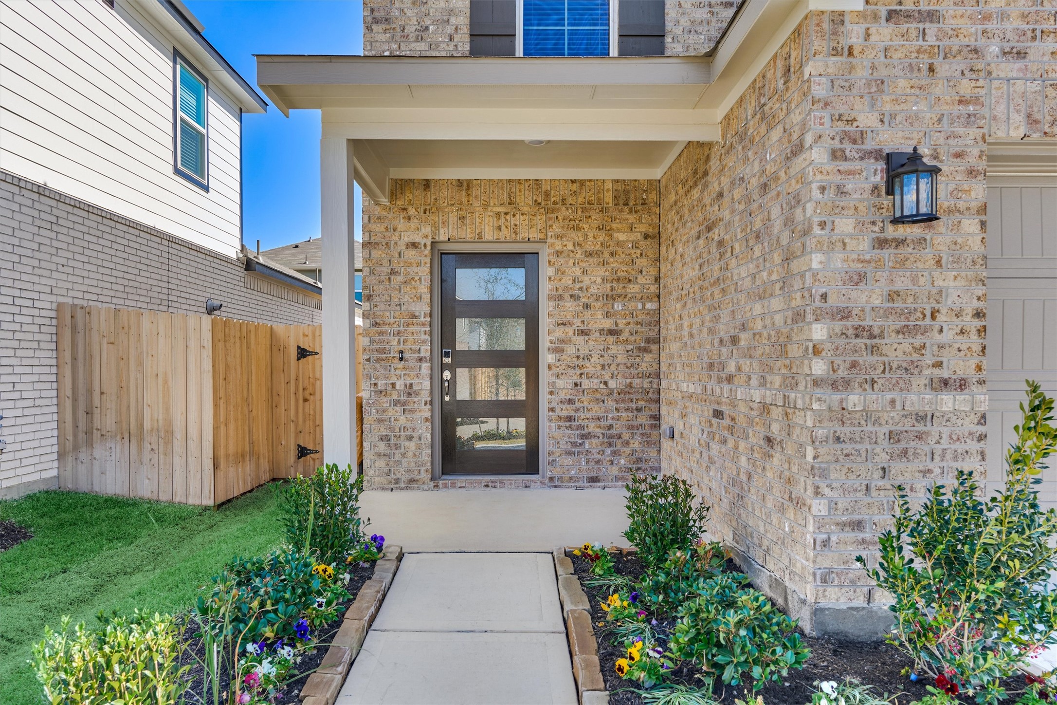 282 Brazen Forest Trail Magnolia, TX 77355 - Photo 4 of 36 a front view of a house with a garden