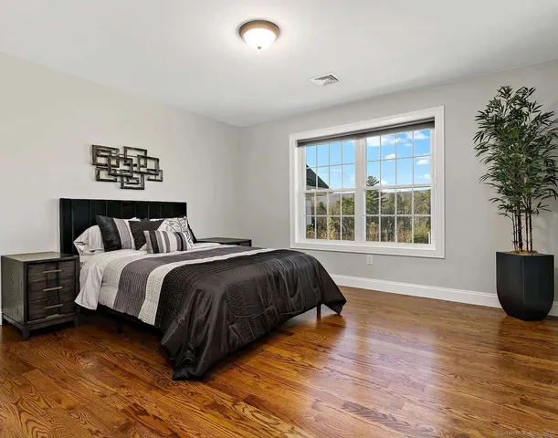 a bedroom with a bed and window