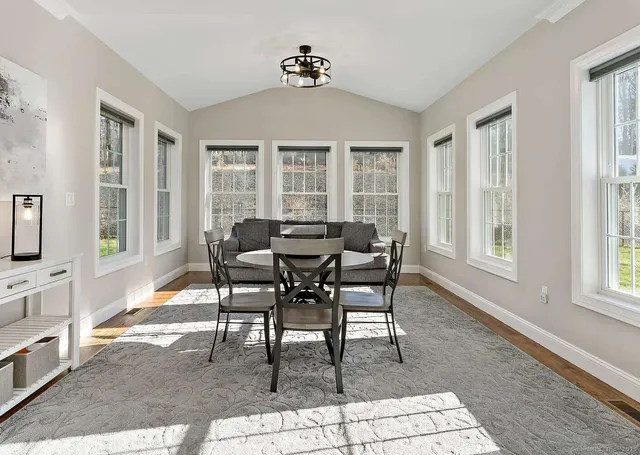 a view of a dining room with furniture window and outside view