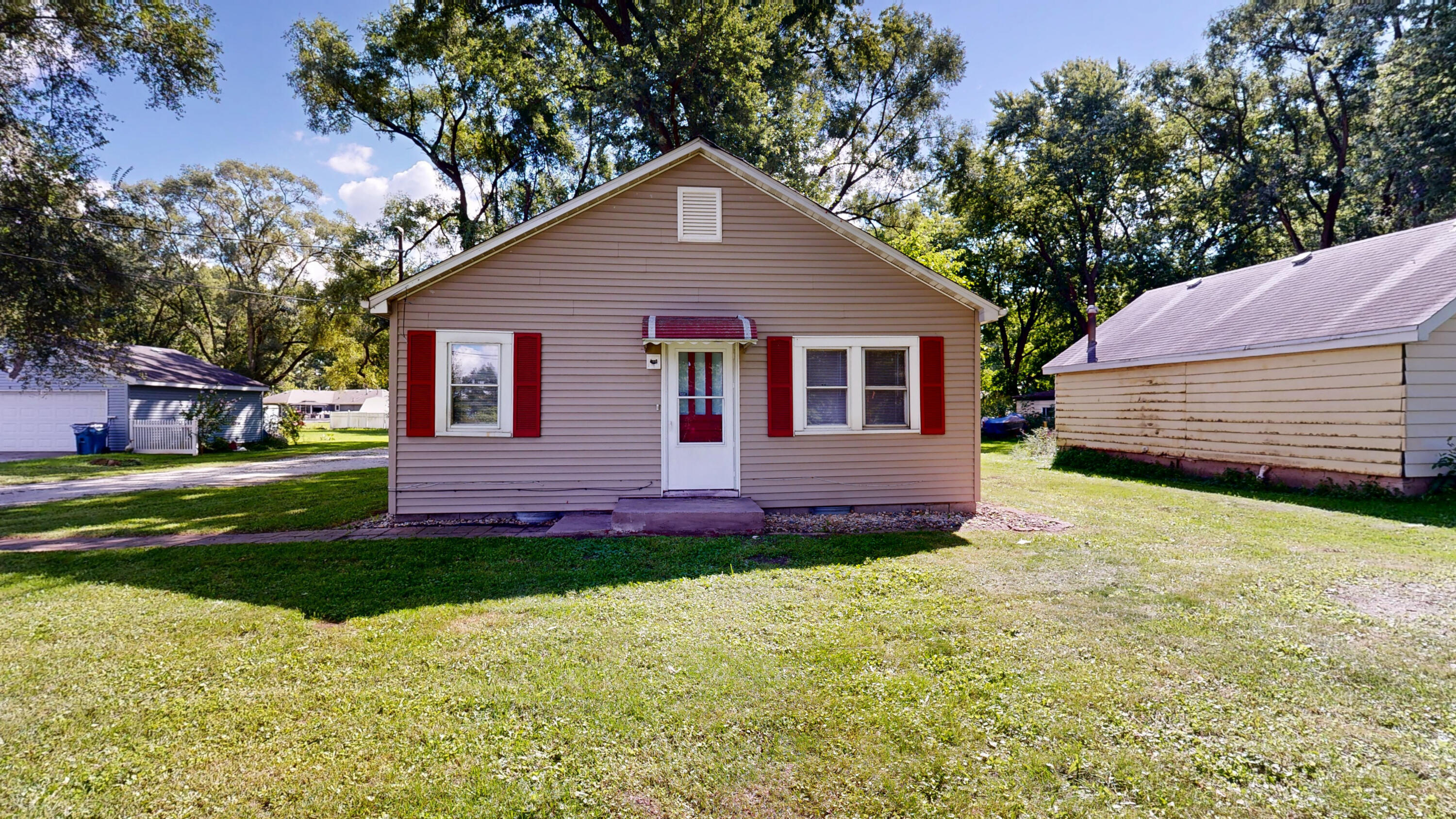 4305 Colfax Street Gary, IN 46408 - Photo 15 of 27 a front view of a house with a garden and yard