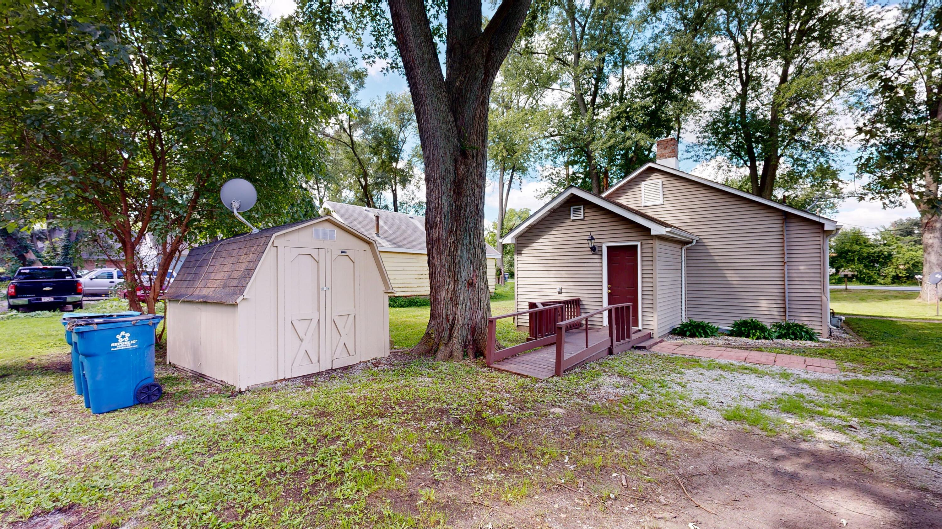 4305 Colfax Street Gary, IN 46408 - Photo 17 of 27 a view of backyard with outdoor seating and wooden fence