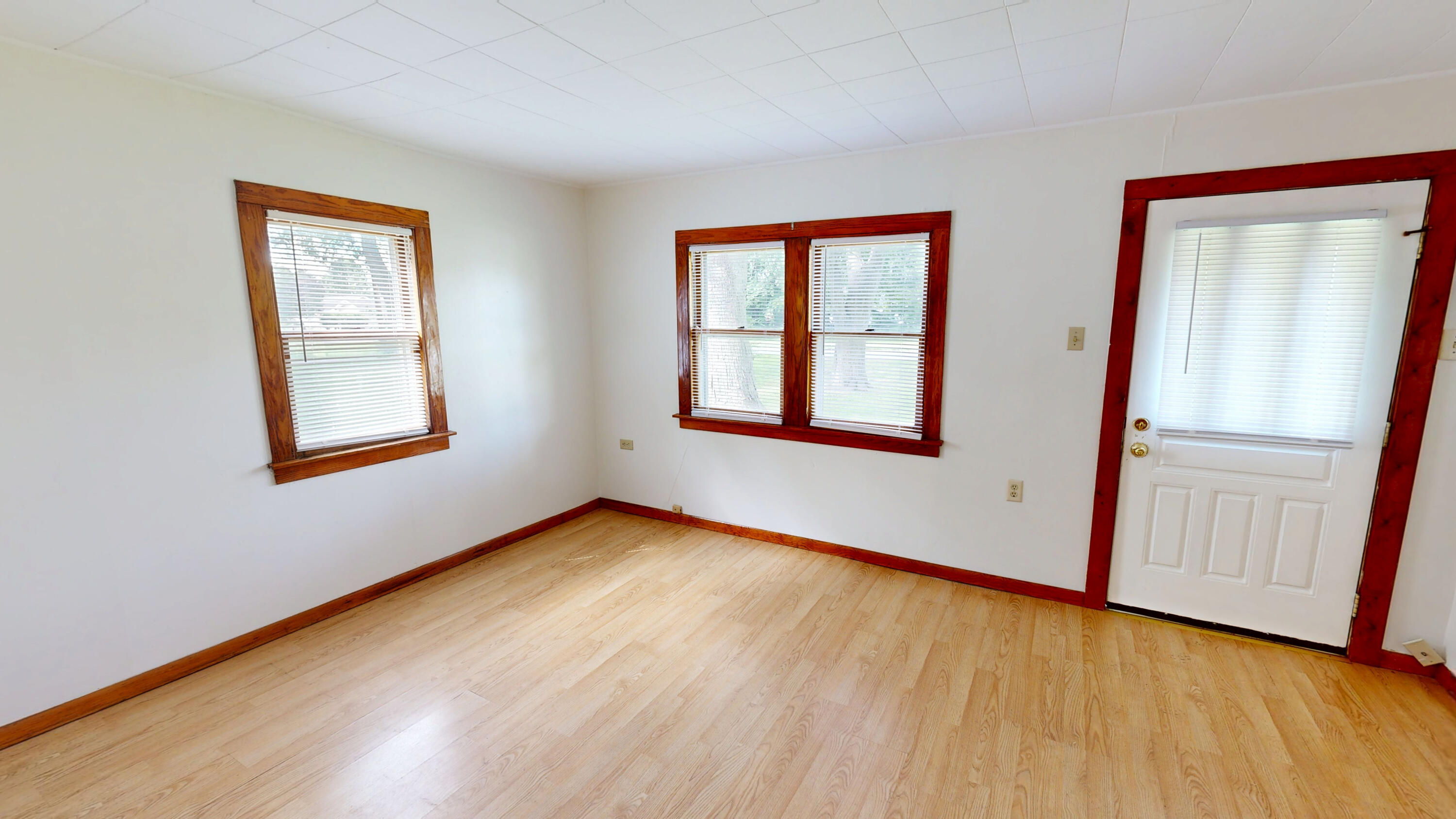 4305 Colfax Street Gary, IN 46408 - Photo 20 of 27 an empty room with wooden floor and windows