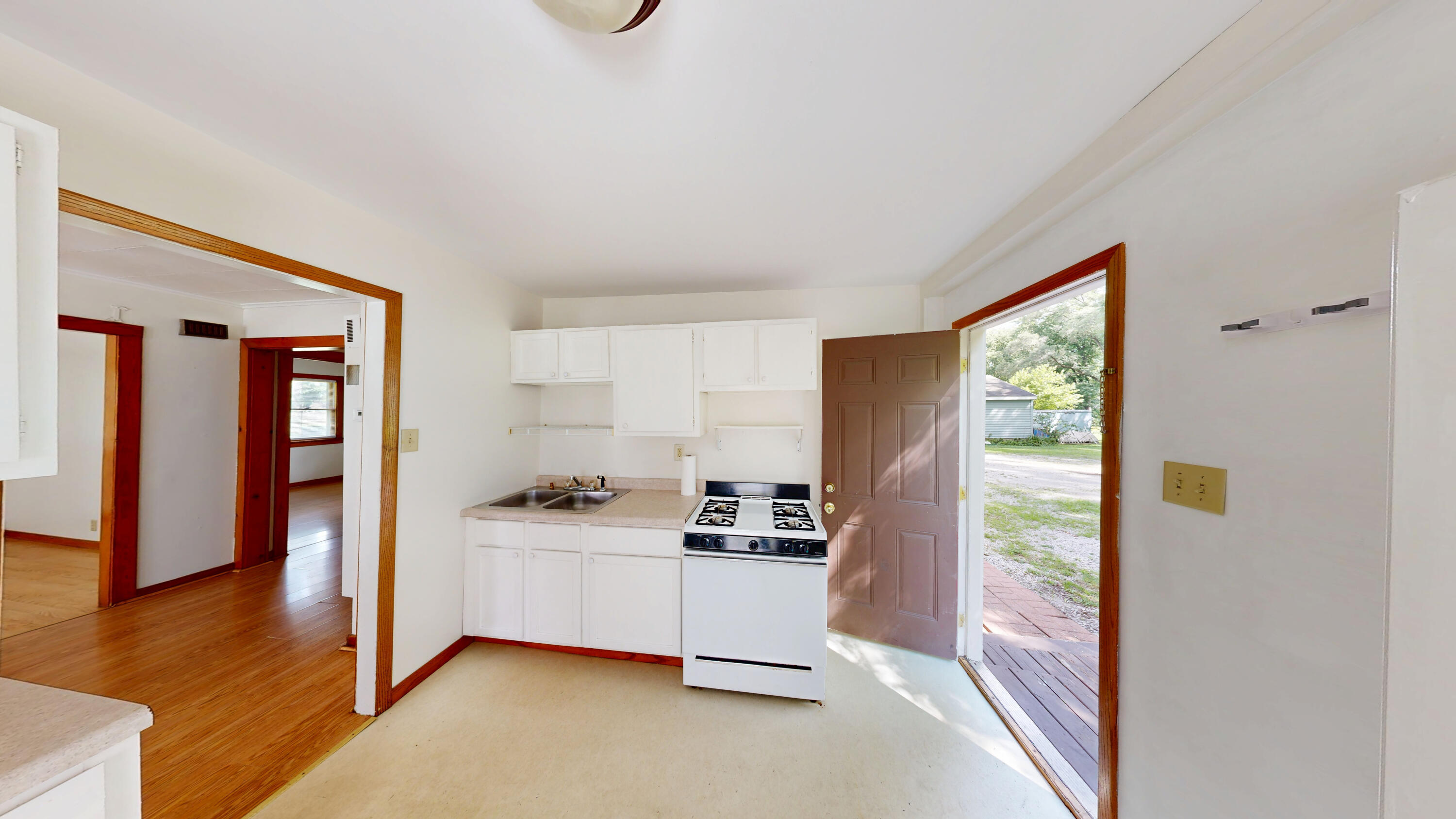 4305 Colfax Street Gary, IN 46408 - Photo 25 of 27 a kitchen with stainless steel appliances a sink and a large window