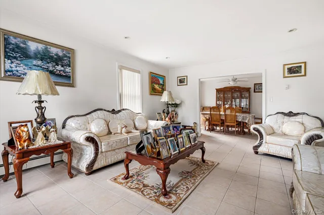 a living room with furniture and a lamp