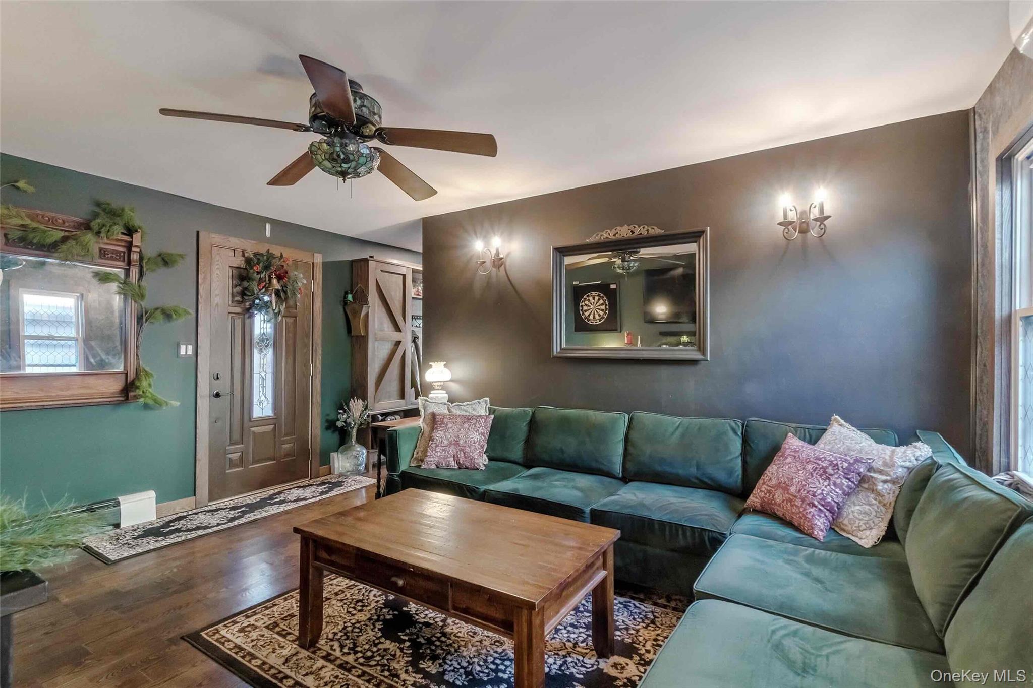 27 West 11th Road Queens, NY 11693 - Photo 5 of 18 Living room with ceiling fan and wood finished floors