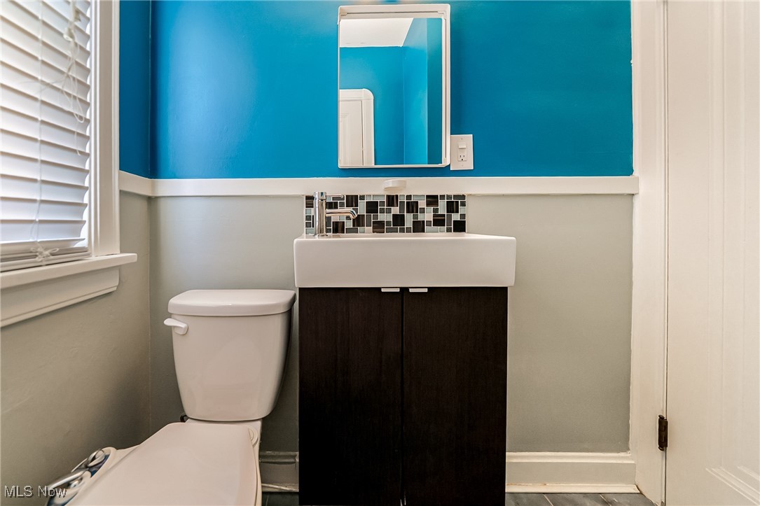 6711 Forest Avenue Parma, OH 44129 - Photo 21 of 33 Half bathroom featuring vanity and toilet