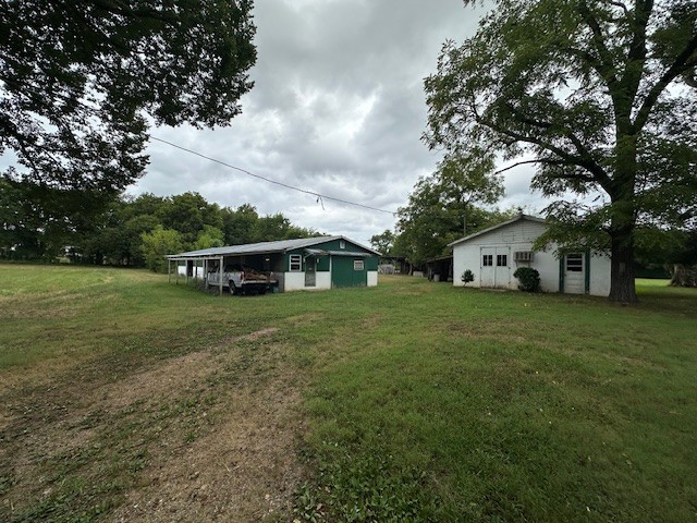 235 Old Mulberry Road Fayetteville, TN 37334 - Photo 28 of 37 a front view of a house with a garden