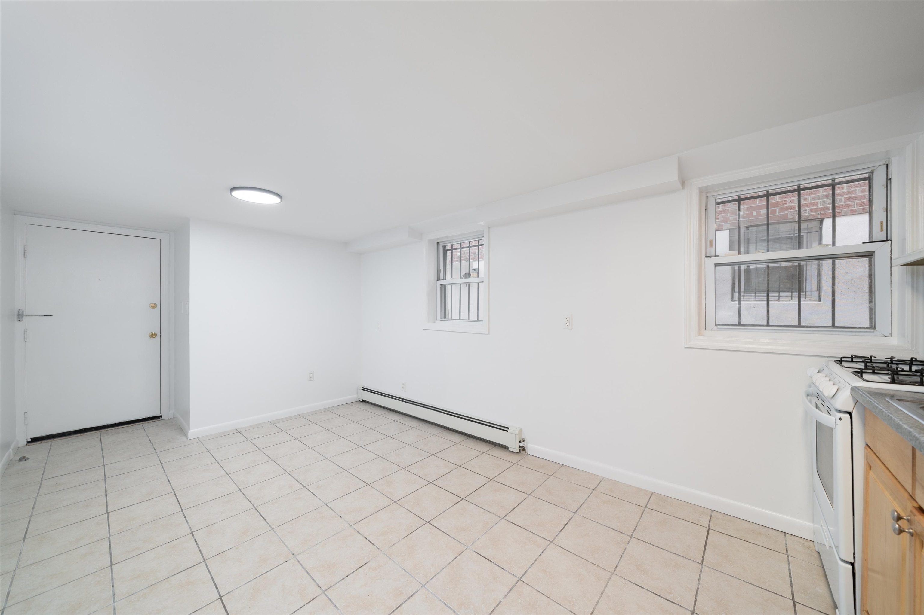 720 Liberty Avenue, Unit 1 North Bergen, NJ 07047 - Photo 2 of 9 a view of an empty room with a window