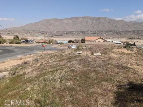 a view of a town with mountains in the background