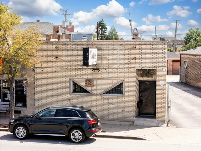 a view of a car parked in front of a building