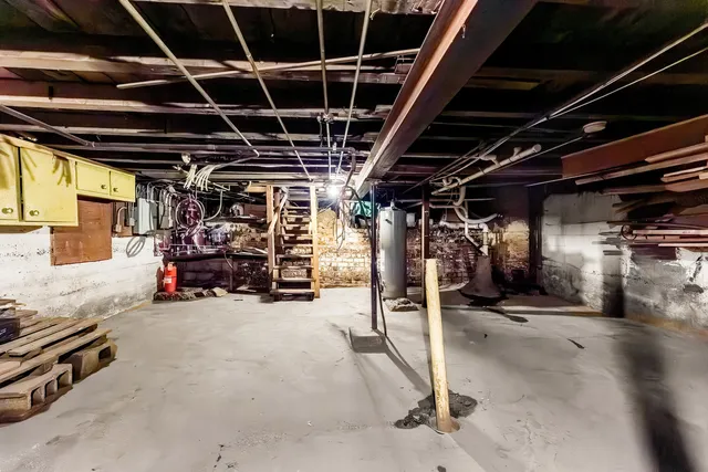a view of a garage with wooden shelves