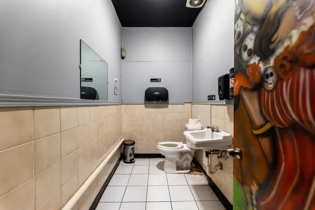 a bathroom with a toilet and a sink