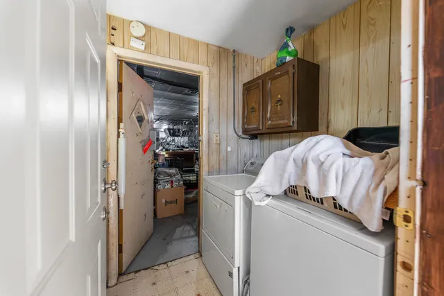 a bedroom with a bed and a mirror