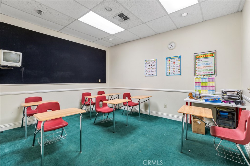 22706 Aspan Street, Unit 16 Lake Forest, CA 92630 - Photo 19 of 34 a reading room with furniture and a projector