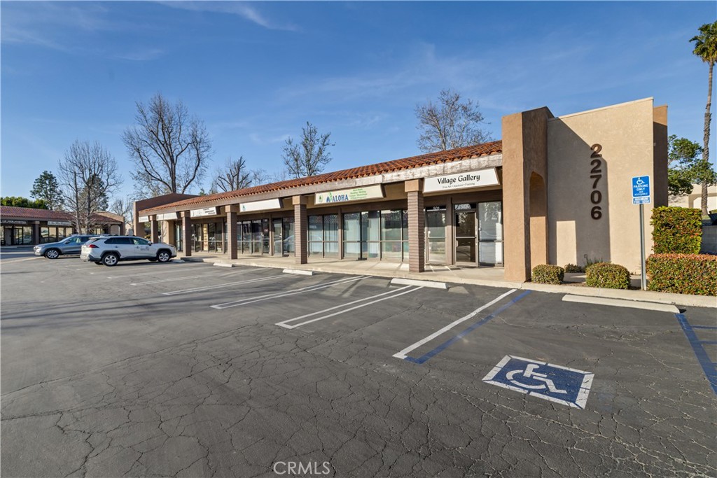 22706 Aspan Street, Unit 16 Lake Forest, CA 92630 - Photo 3 of 34 a view of a building with a street