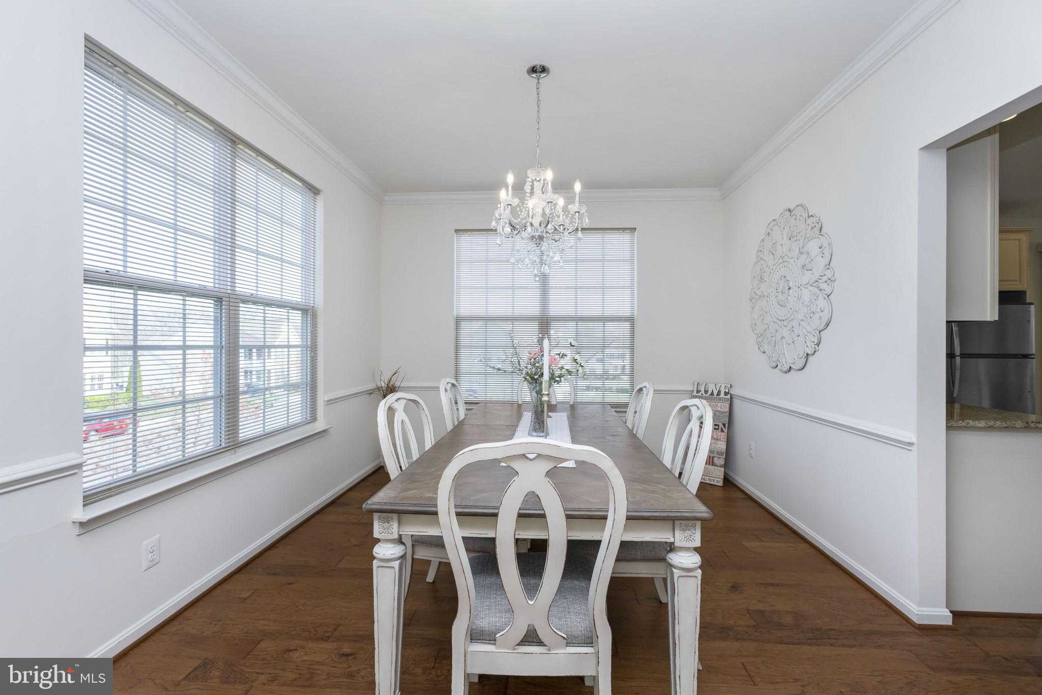 43114 Rocks Way Leesburg, VA 20176 - Photo 4 of 37 Dining room with chair railings and views.