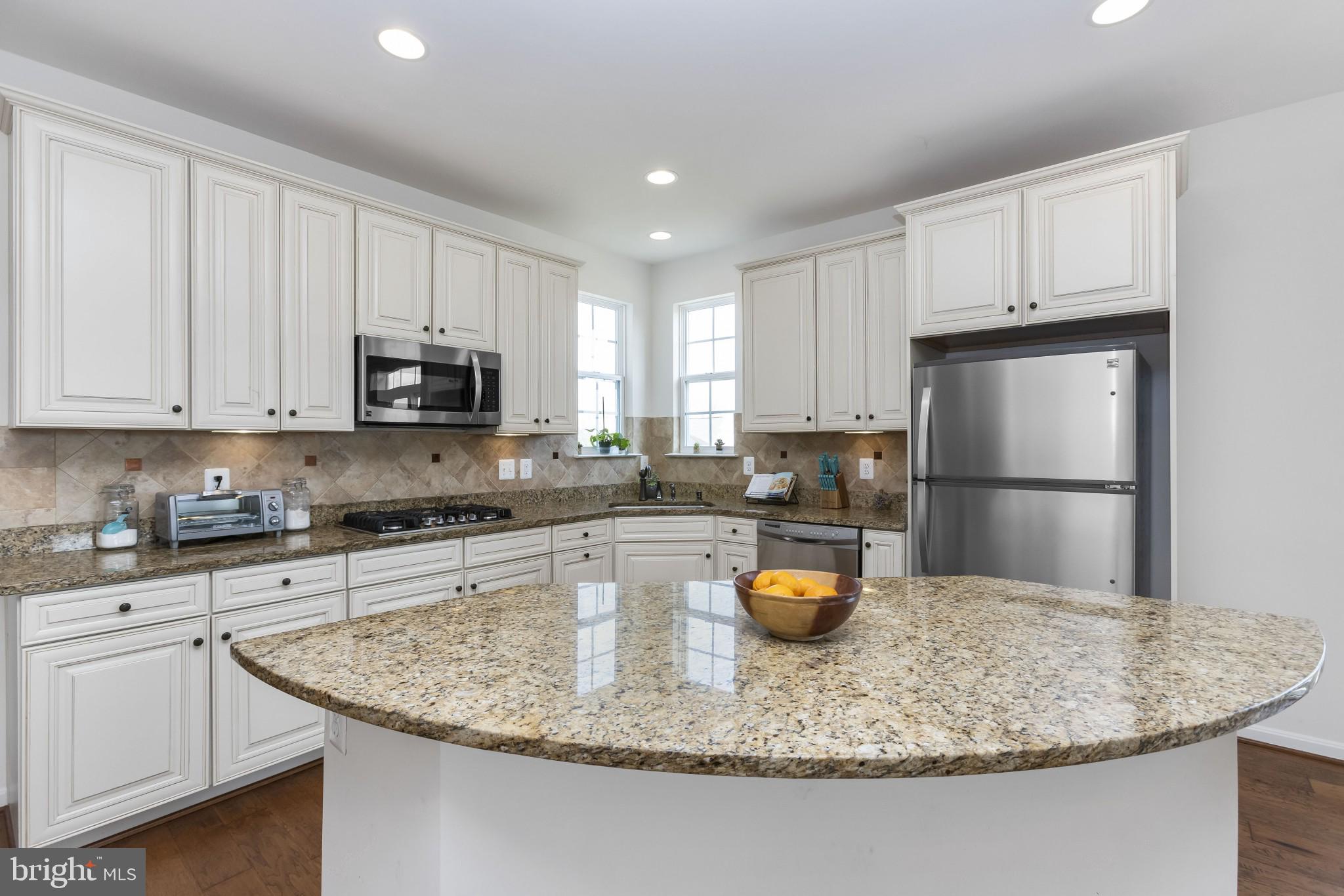 43114 Rocks Way Leesburg, VA 20176 - Photo 7 of 37 Check out this island! Granite and upgraded cabs!