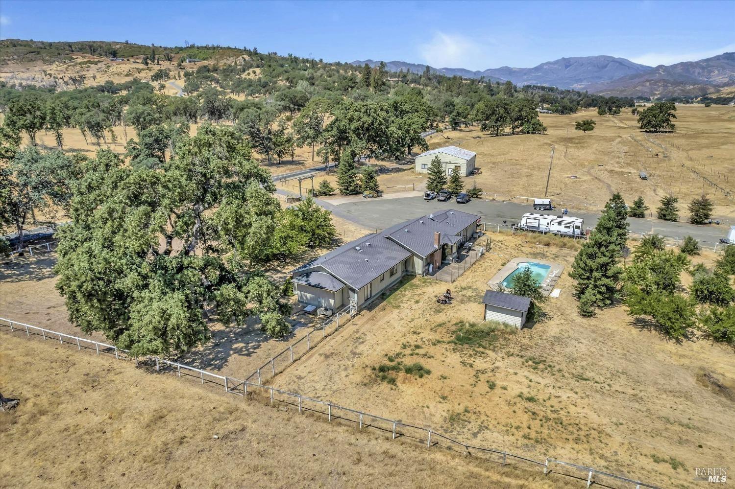 17320 Butts Canyon Road Middletown, CA 95461 - Photo 5 of 13 a view of a lake with mountains in the background