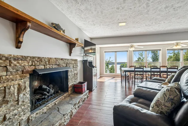 a kitchen with stainless steel appliances granite countertop a stove microwave and sink