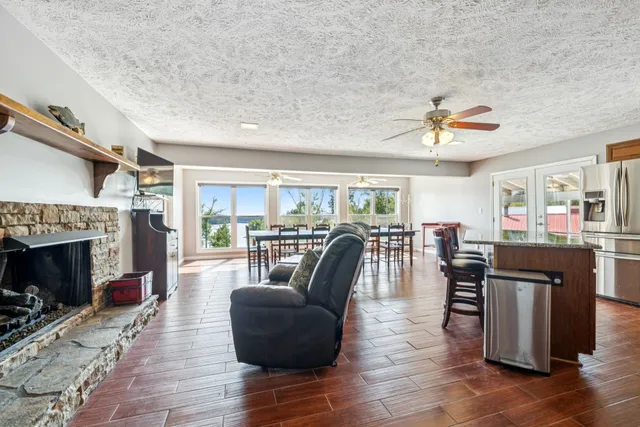 a kitchen with stainless steel appliances granite countertop a stove and a microwave