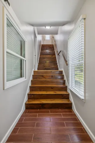 a bathroom with a toilet sink vanity tub and shower