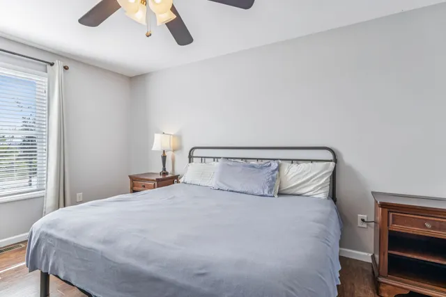 an aerial view of residential houses with outdoor space and lake view