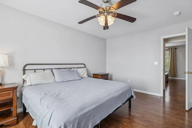 an aerial view of residential houses with outdoor space and lake view