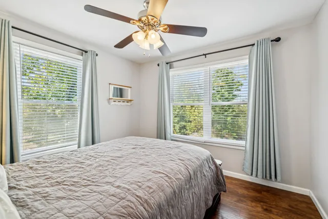 a view of a ocean with boats and trees in the background