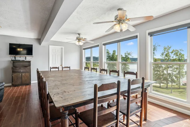a view of a dining room with furniture window and outside view