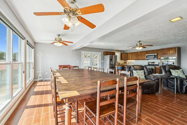 a view of a dining room with furniture window and outside view