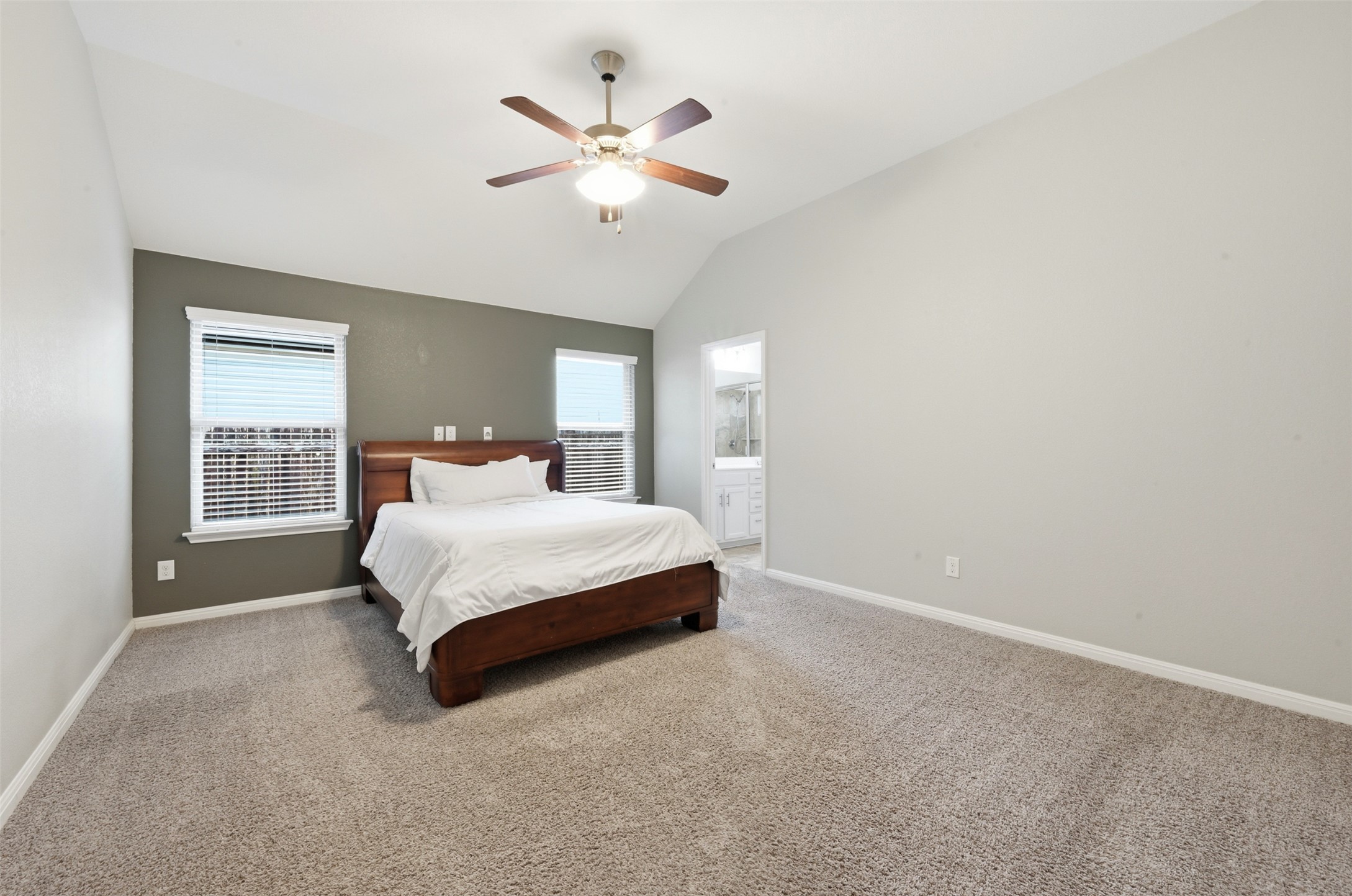 13116 Alans Way Manchaca, TX 78652 - Photo 13 of 25 Carpeted room with a vaulted ceiling and a ceiling fan