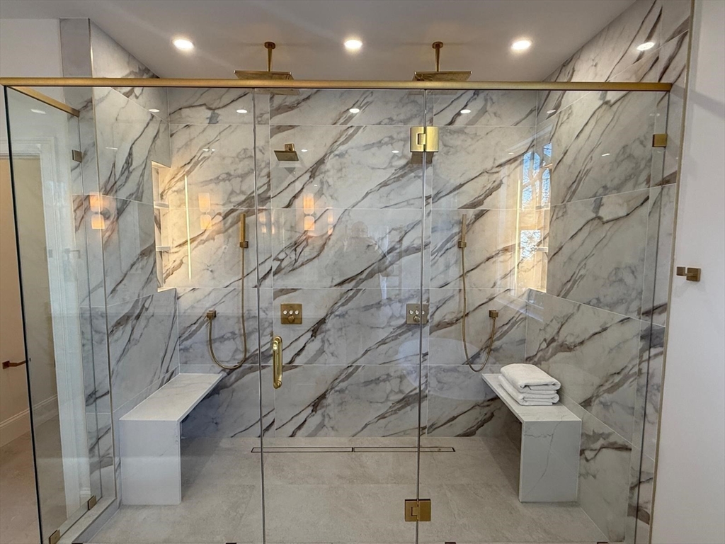 a bathroom with a shower and a sink