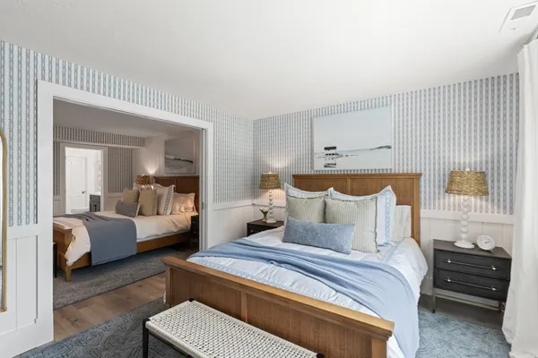 a bedroom with a bed and a window with outer view