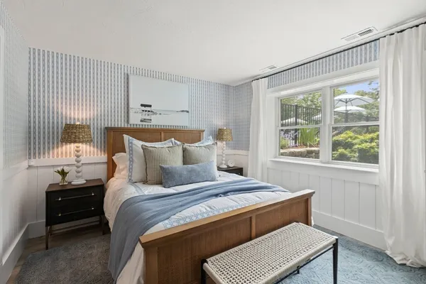 a bedroom with bed and a couch