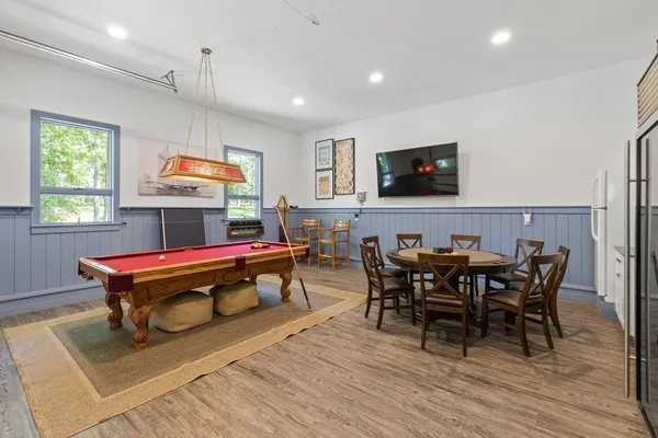 a view of a dining room with furniture and wooden floor