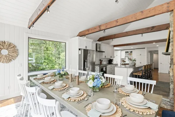 a view of a dining room with furniture window and outside view