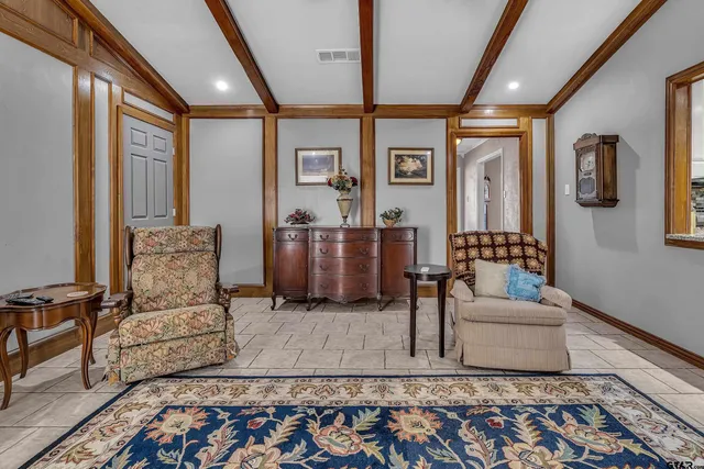 a living room with furniture and a rug