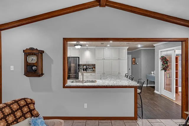 a room with a mirror and furniture