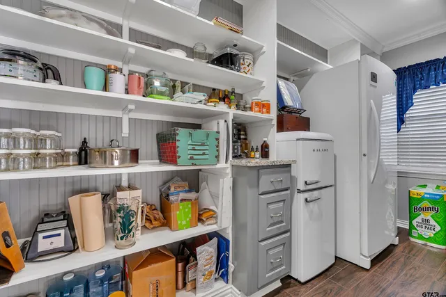 a view of kitchen and cabinets