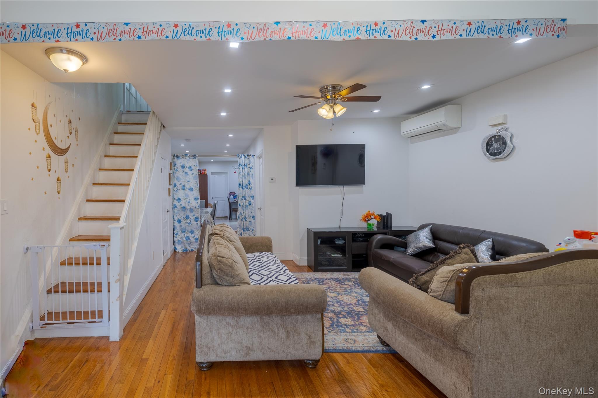 97-14 88th Street Queens, NY 11416 - Photo 3 of 14 a living room with furniture and a flat screen tv