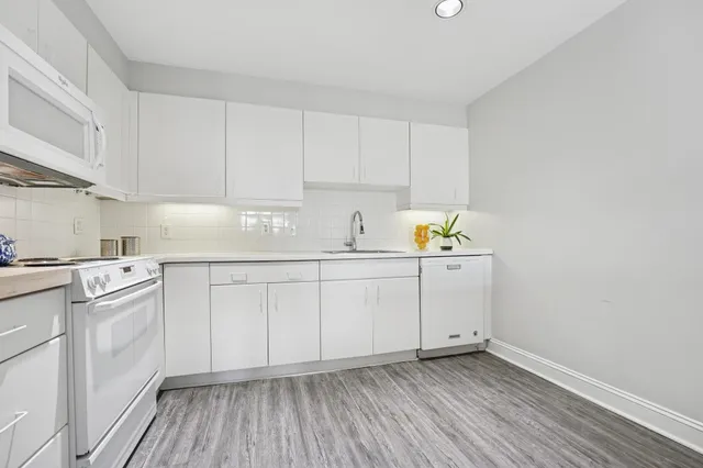 a kitchen with a sink and cabinets
