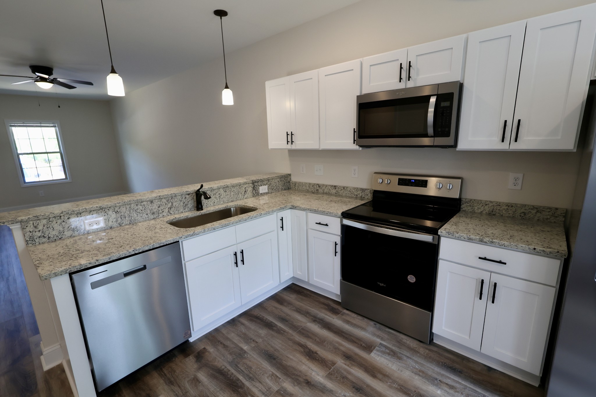 500 Peachers Mill Road, Unit B2 Clarksville, TN 37042 - Photo 11 of 33 a kitchen with a sink stove and microwave