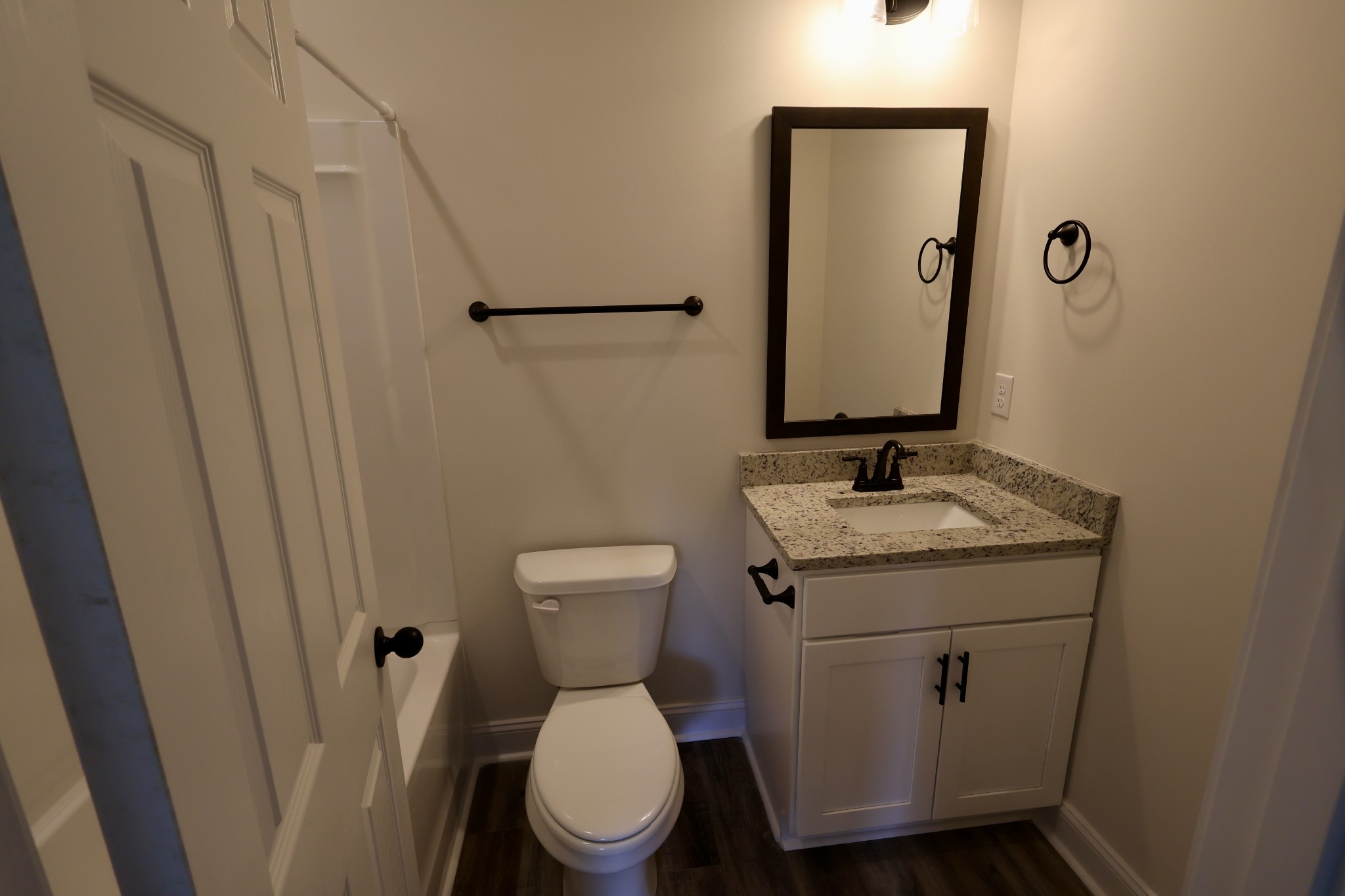 500 Peachers Mill Road, Unit B2 Clarksville, TN 37042 - Photo 21 of 33 a bathroom with a granite countertop toilet sink and mirror