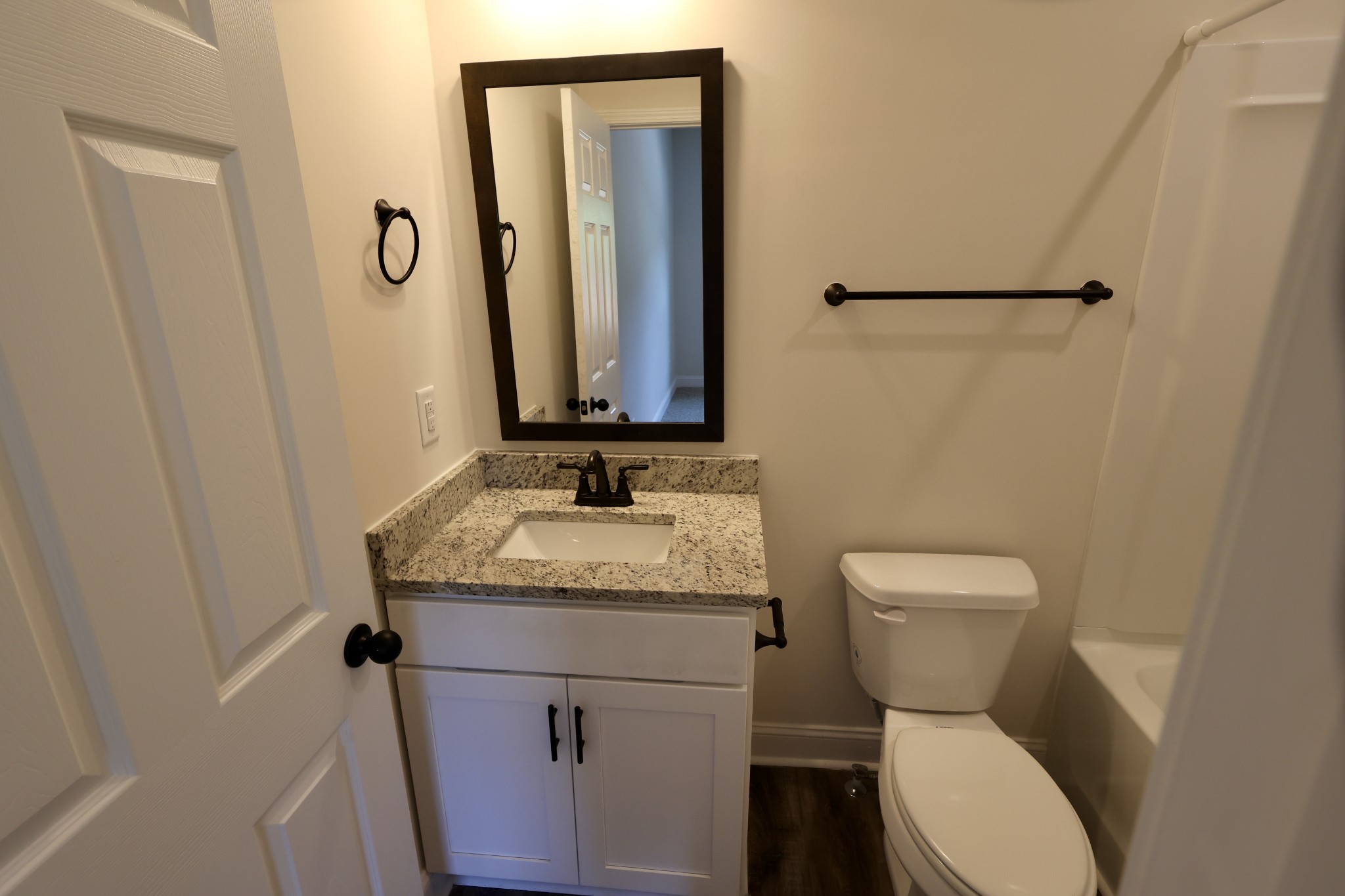 500 Peachers Mill Road, Unit B2 Clarksville, TN 37042 - Photo 26 of 33 a bathroom with a granite countertop sink toilet and mirror