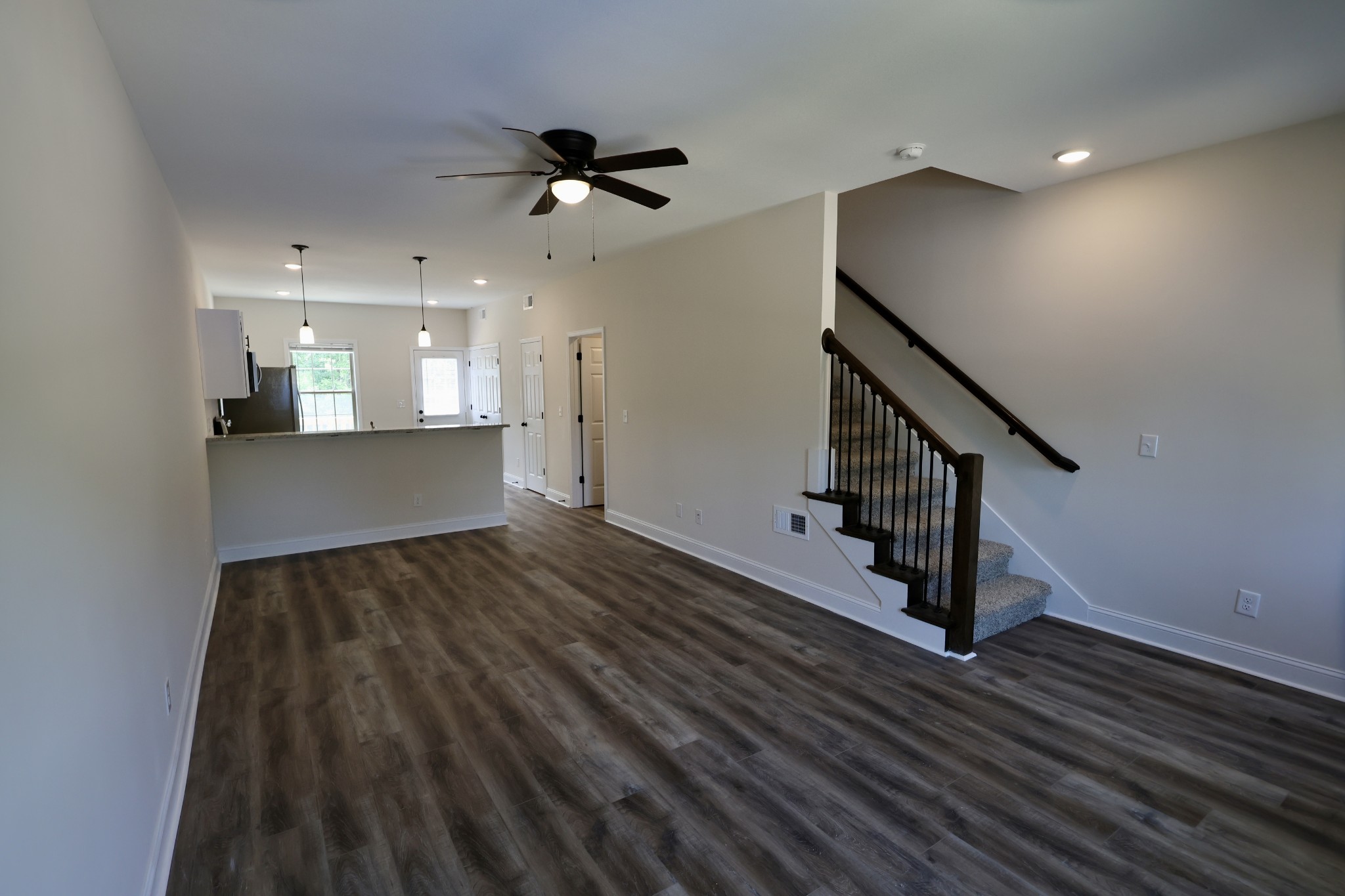 500 Peachers Mill Road, Unit B2 Clarksville, TN 37042 - Photo 6 of 33 a view of a hallway with wooden floor and staircase