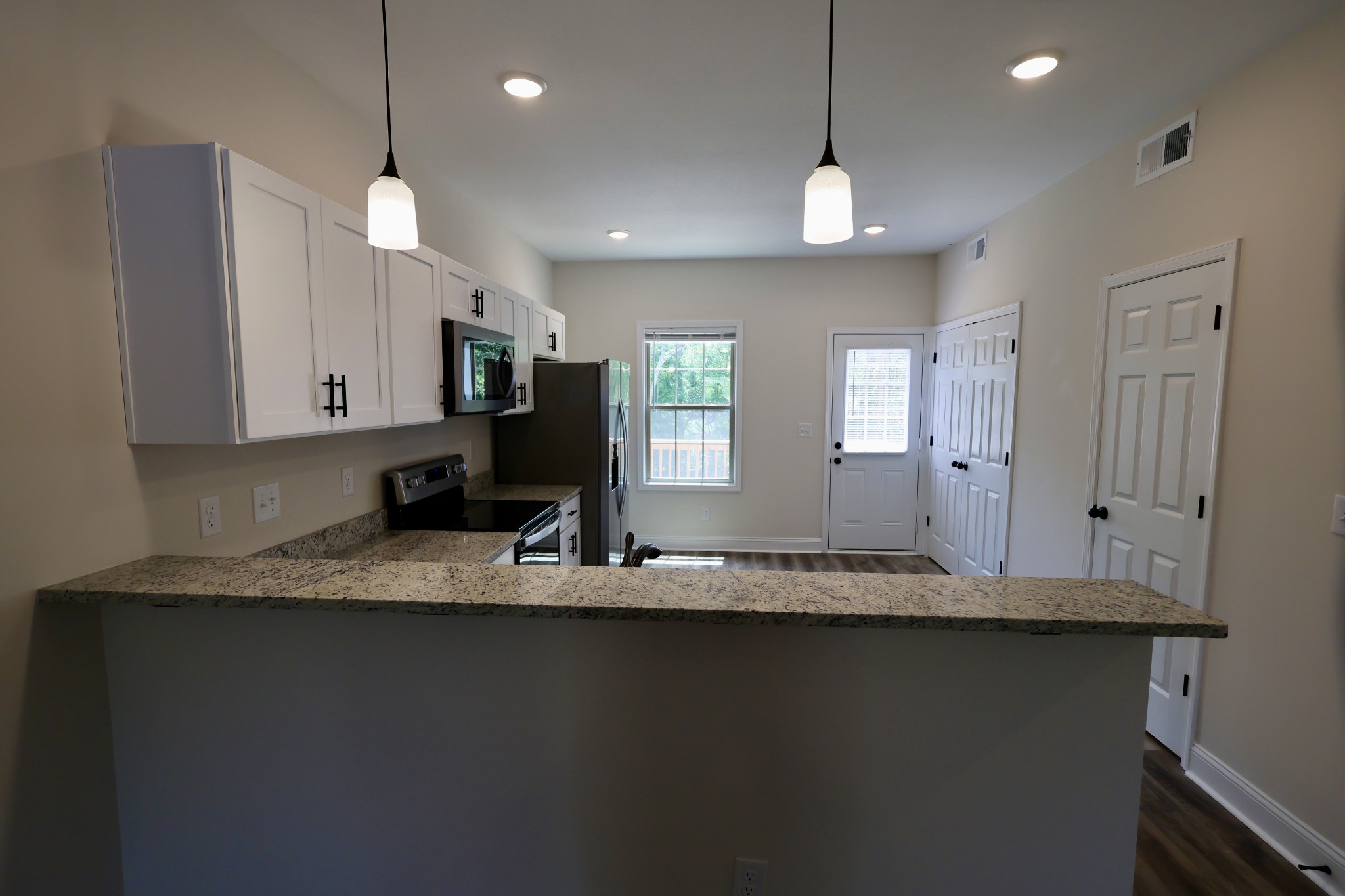 500 Peachers Mill Road, Unit B2 Clarksville, TN 37042 - Photo 8 of 33 a view of a kitchen with kitchen island a sink stainless steel appliances and cabinets