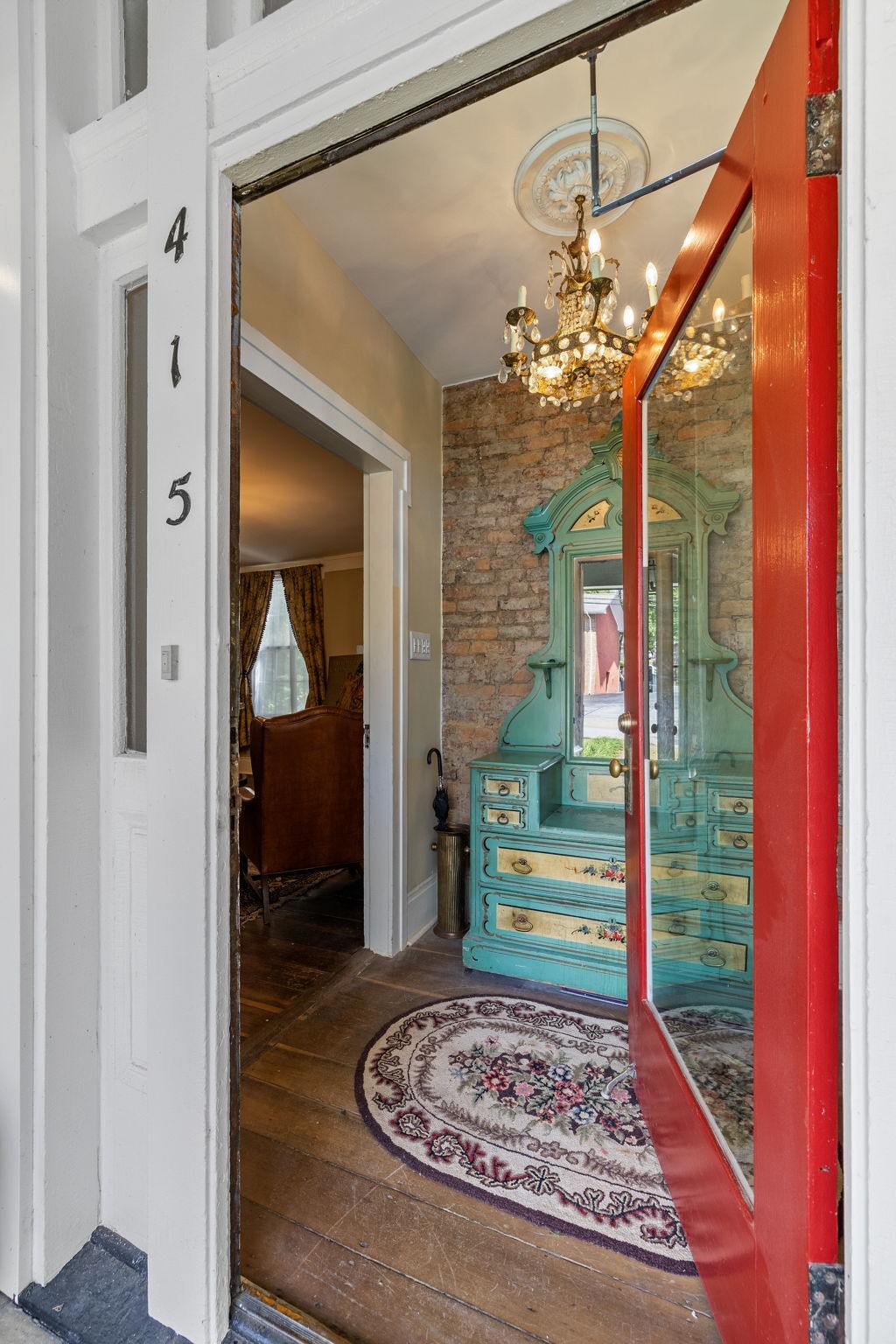 415 West 9th Street Columbia, TN 38401 - Photo 11 of 70 a view of a hallway and a dining room with a chandelier