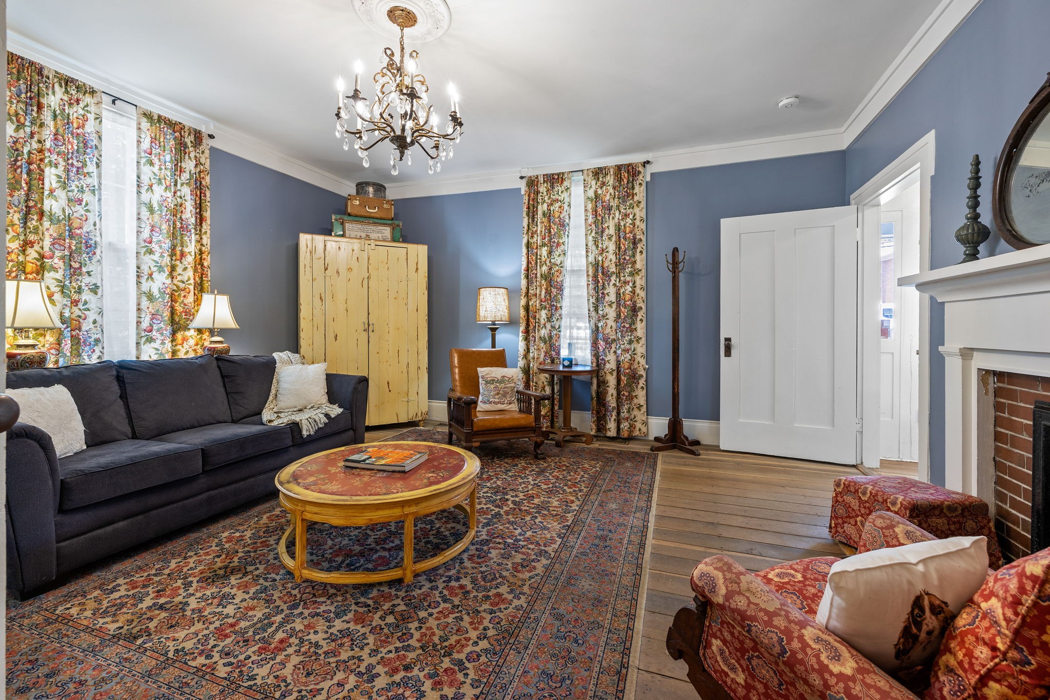 415 West 9th Street Columbia, TN 38401 - Photo 26 of 70 a living room with furniture a fireplace and a chandelier