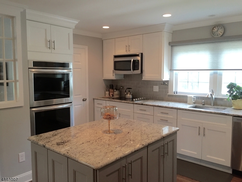 2 Spring Street Far Hills, NJ 07931 - Photo 1 of 16 a kitchen with granite countertop kitchen island a sink appliances cabinets and counter space