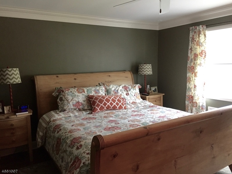 2 Spring Street Far Hills, NJ 07931 - Photo 11 of 16 a bedroom with a bed and window